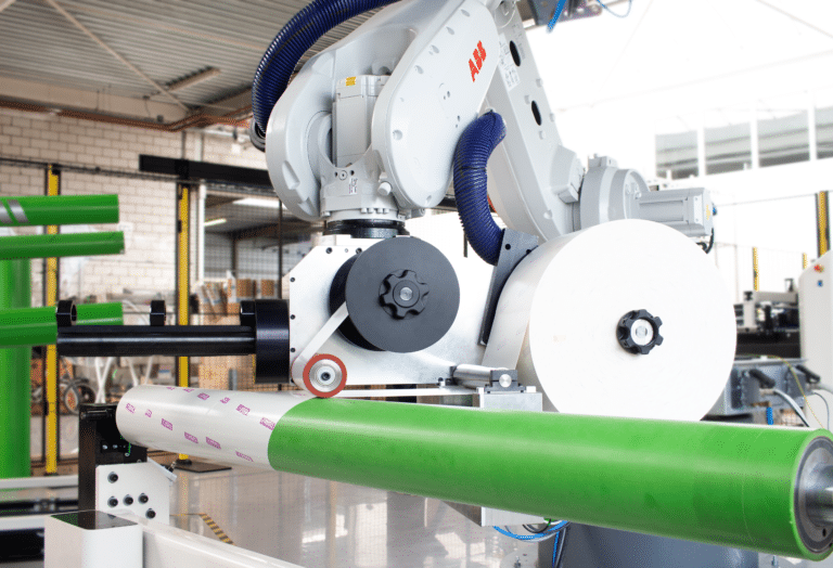 Robot mounting of plate mounting tape eliminates manual taping, other tape errors causing time waste.